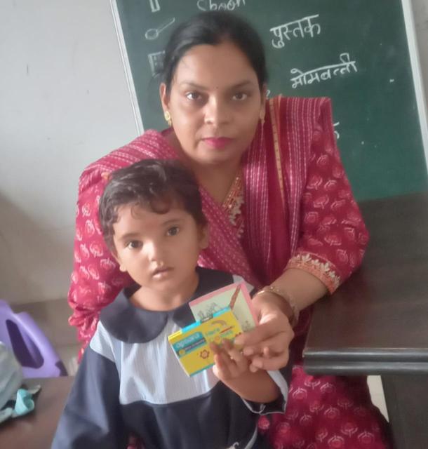 A teacher with her little learner