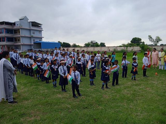 Students with flags on the ground